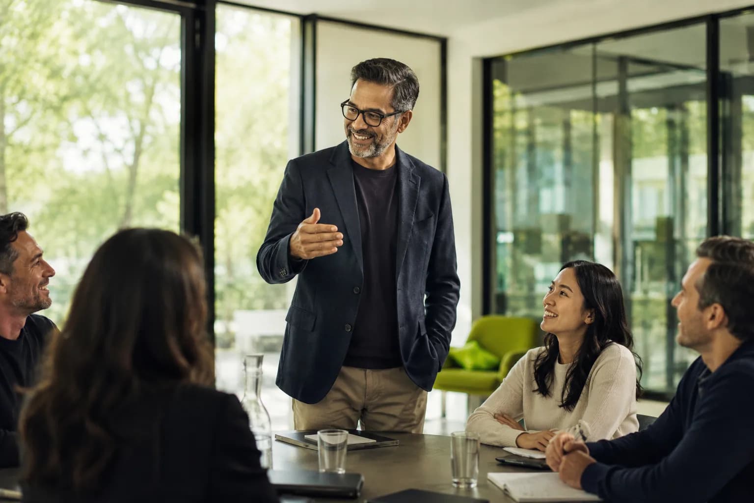 An operator presenting a point of view to respected peers in a bright modern meeting room, showing how founders win on substance rather than reach.