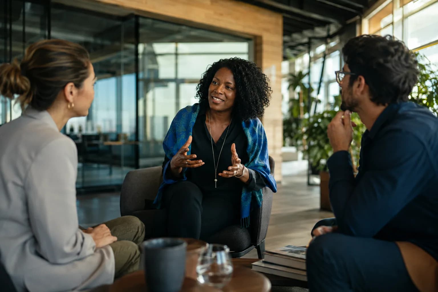 A composed expert confidently explaining an idea to engaged colleagues in a bright modern office, illustrating how expert visibility turns expertise into market recognition.
